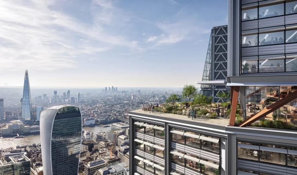 A high-altitude open-air terrace featuring a landscaped garden, safety barriers, and panoramic views of the city.
