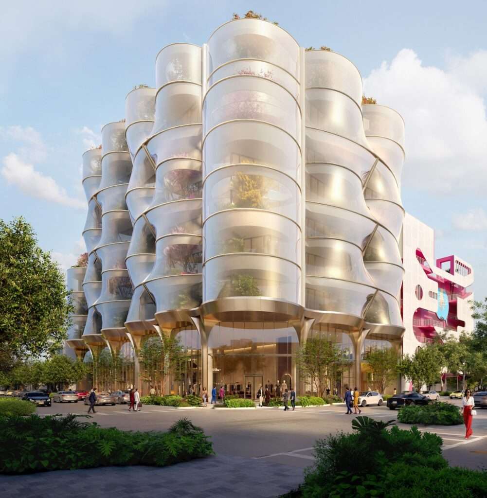 Daytime view of an eight-story building with a bulbous mesh sunscreen and corner glazing.