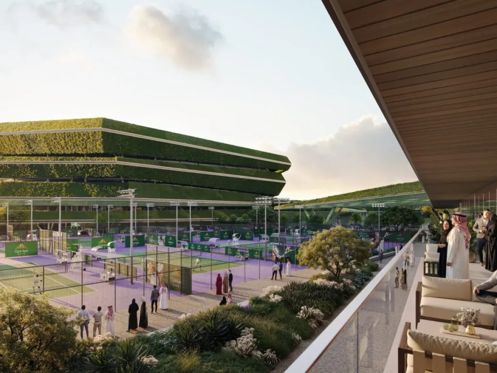 A series of outdoor tennis courts viewed from an elevated viewing terrace with modern lounge furniture.