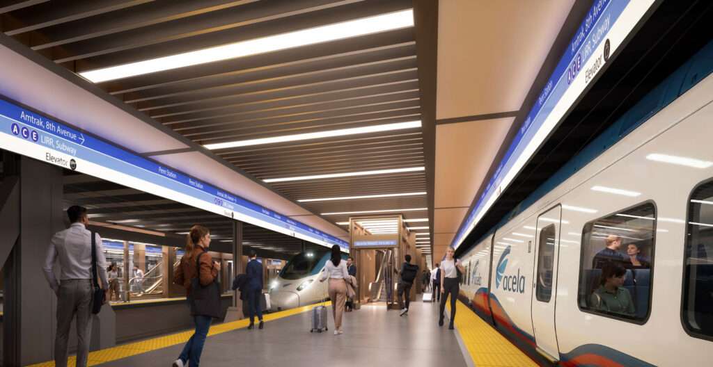 Subterranean train platform with Acela trains, modern linear ceiling lighting, and passenger circulation.