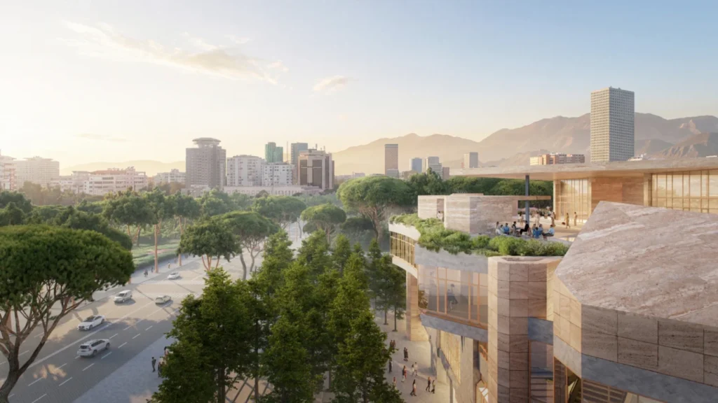 An elevated view looking over the terraced cultural complex toward the cityscape and distant mountains.