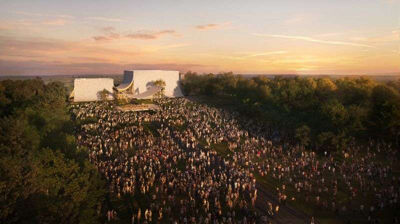 An aerial sunset rendering of a building hosting a massive outdoor crowd and concert in a park.