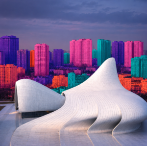 ArchUp photograph contrasting a white fluid parametric structure with a background of densely packed rectangular residential towers digitally saturated in bright pink blue and orange hues
