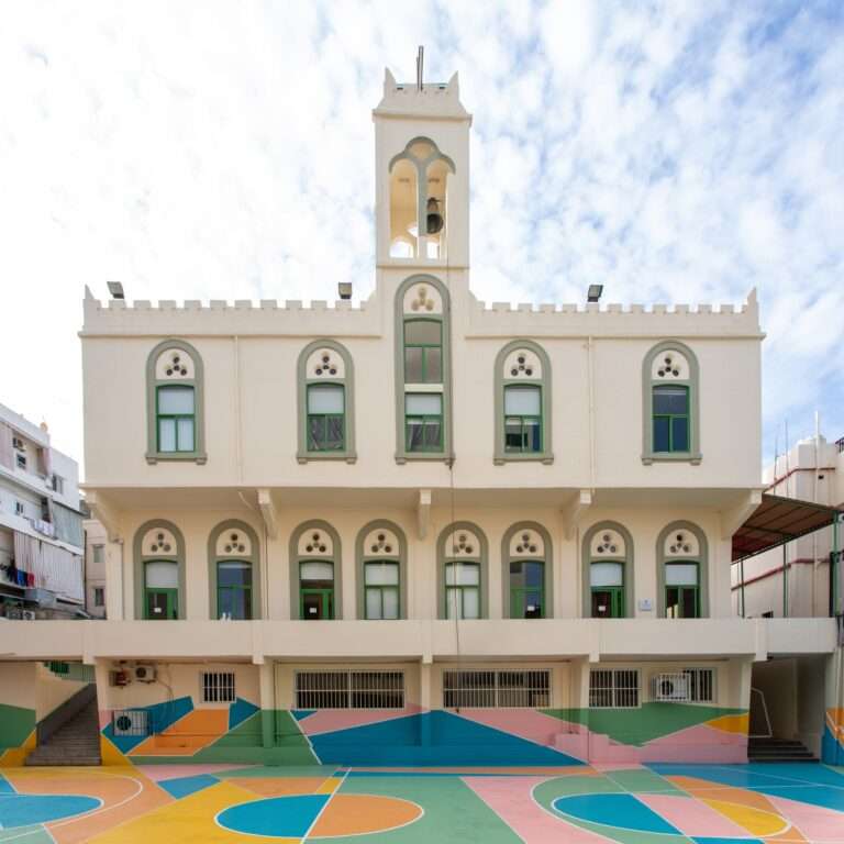 Colorful painted basketball court at Beirut school playground after 2020 blast.
