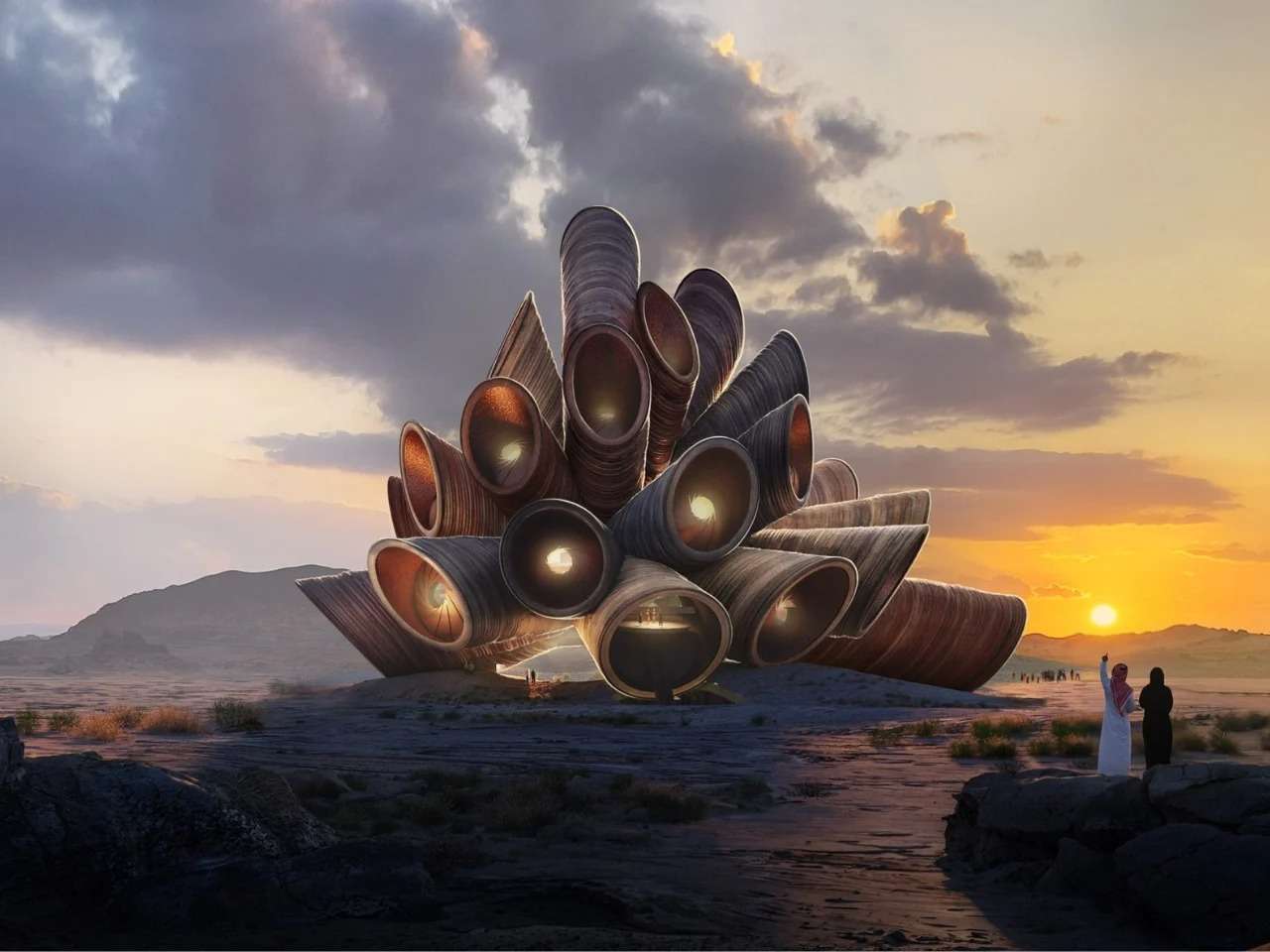 A futuristic tubular stone observatory structure in the AlUla desert during sunset with visitors in the foreground looking at the architecture.