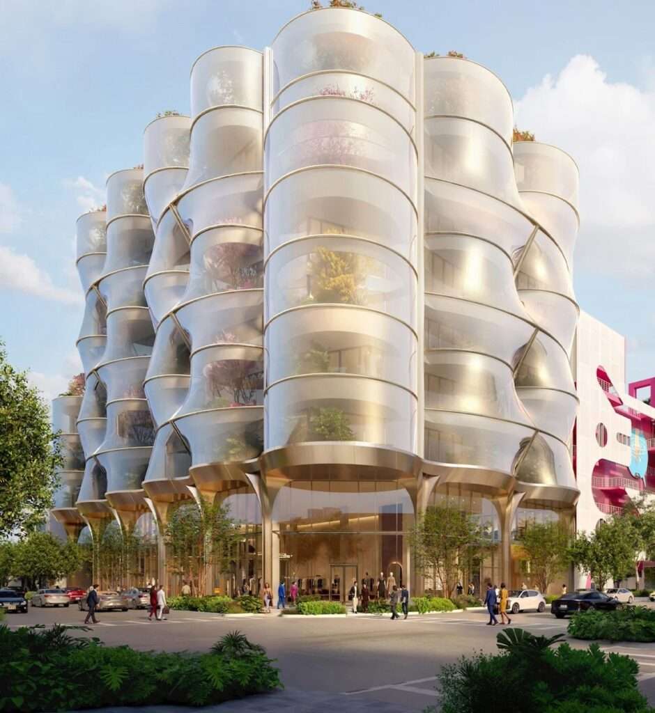 A perspective view from the sidewalk showing pedestrians and parked cars, focusing on how the Sweetbird North facade reveals glimpses of the trees and office activities behind it.