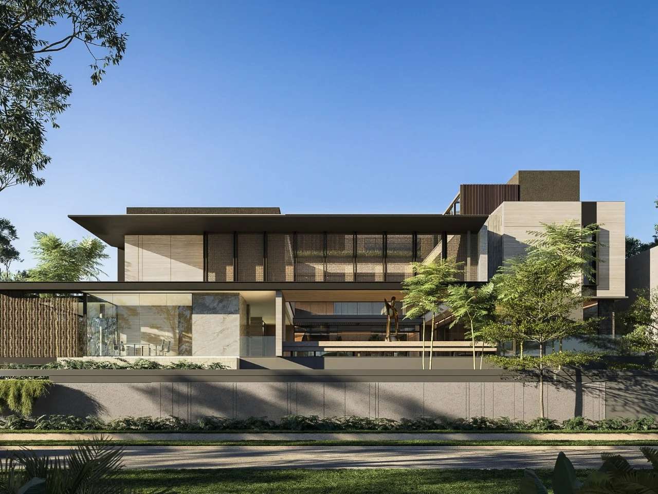 Front facade of SE House in Surabaya showing layered architectural volumes, textured screens, and integrated tropical landscape design.