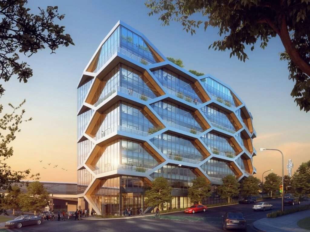 Architectural perspective of The Hive mass timber office building in Vancouver during golden hour, showing its unique hexagonal structure.
