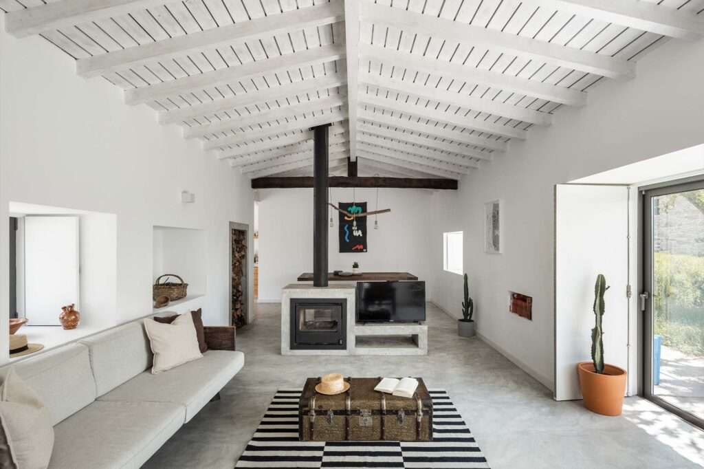 abadim-house-open-plan-living-concrete-fireplace-divider.jpg
