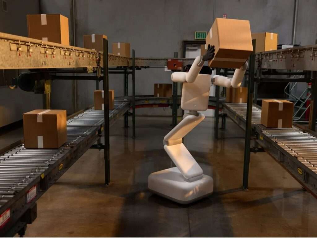 Enno robot lifting a heavy package high above its segmented body along an automated warehouse conveyor line.