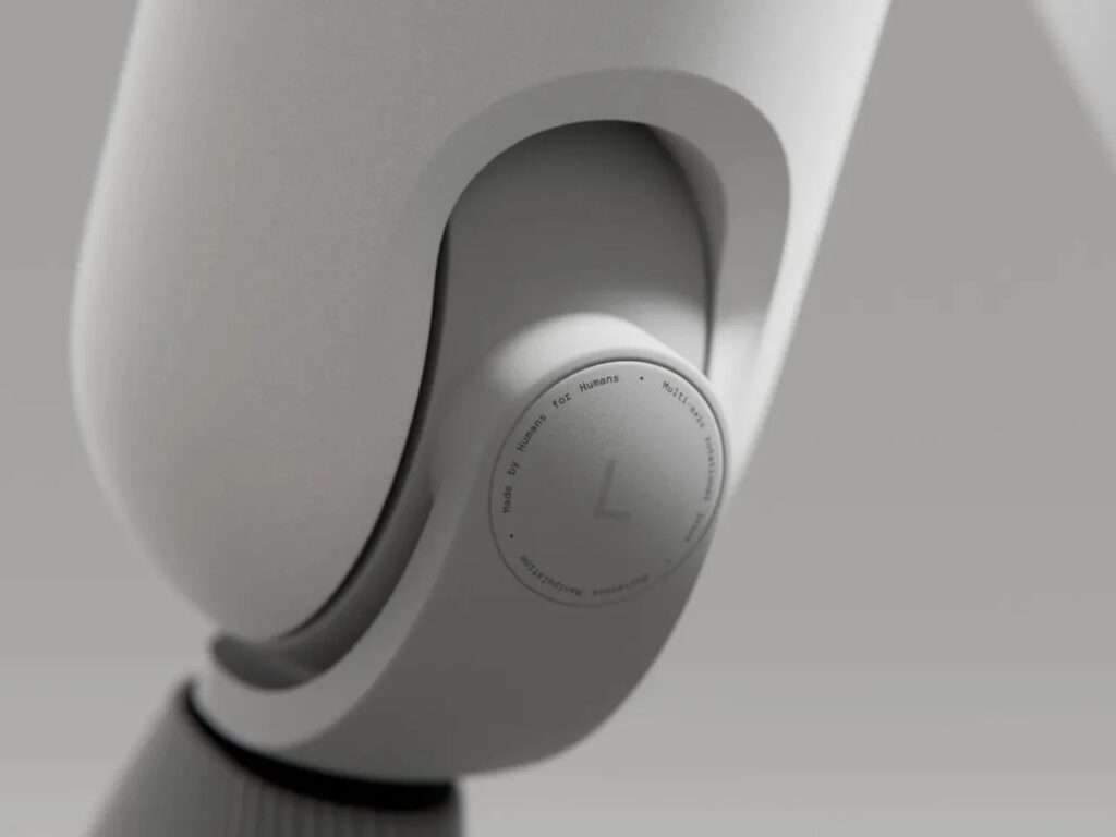 Macro detail of a rotating mechanical joint on the Enno robot with text reading Made by Humans for Humans.