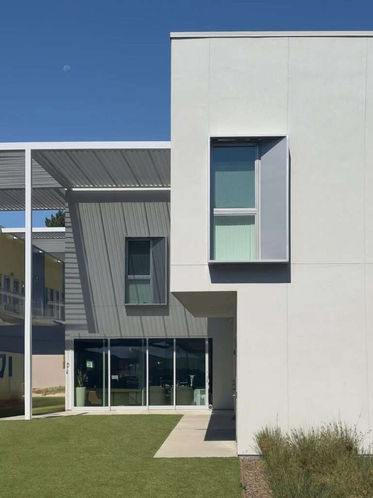 Main entrance sign reading "Northview Pointe" on a blue modern building facade with drought-tolerant landscaping in the foreground.