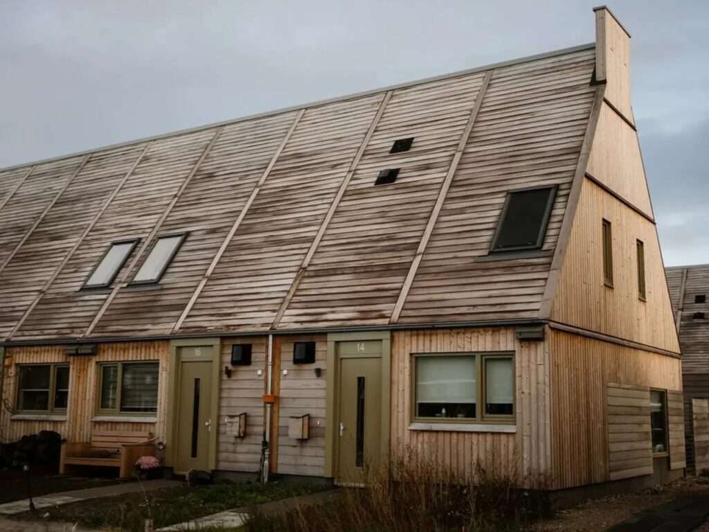 Prefabricated sustainable wooden residential house in Marknesse with traditional-inspired silhouette and bio-based materials.