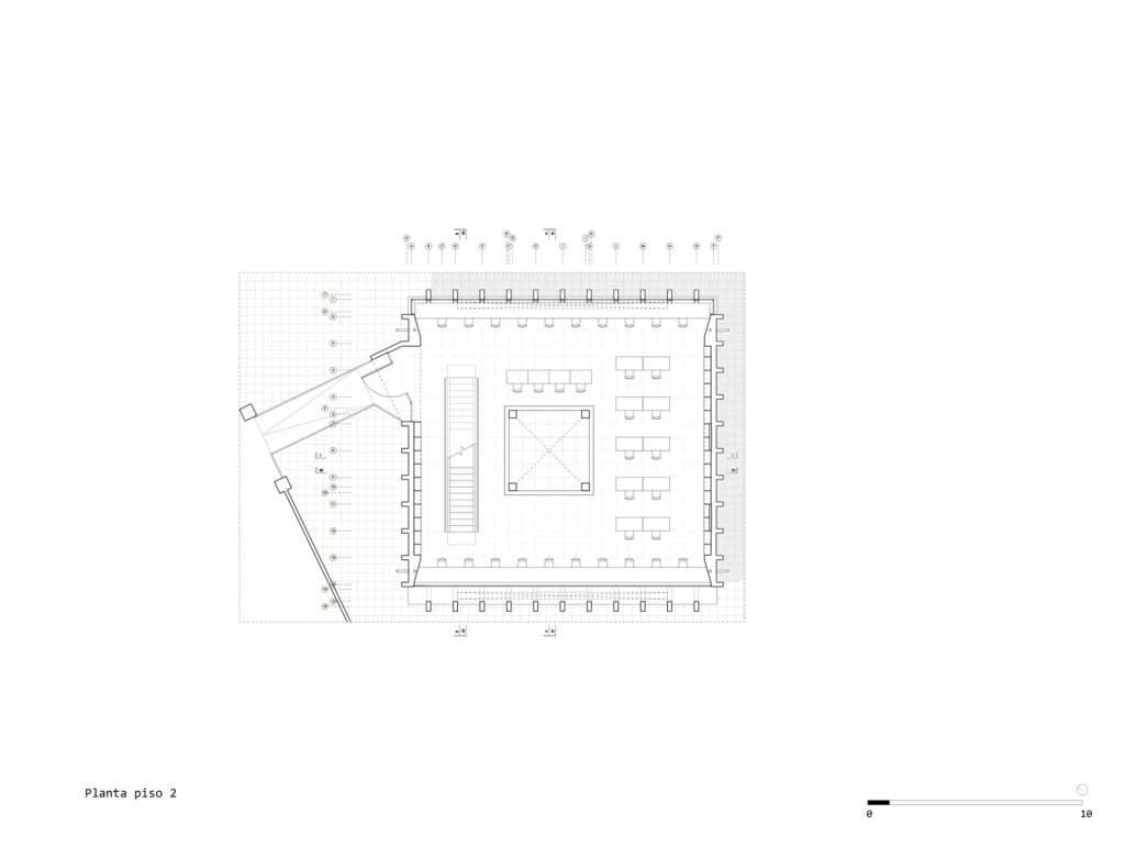 Architectural blueprint of the second-floor plan showing study desks arranged around the central void and the elevated bridge connecting on the left.