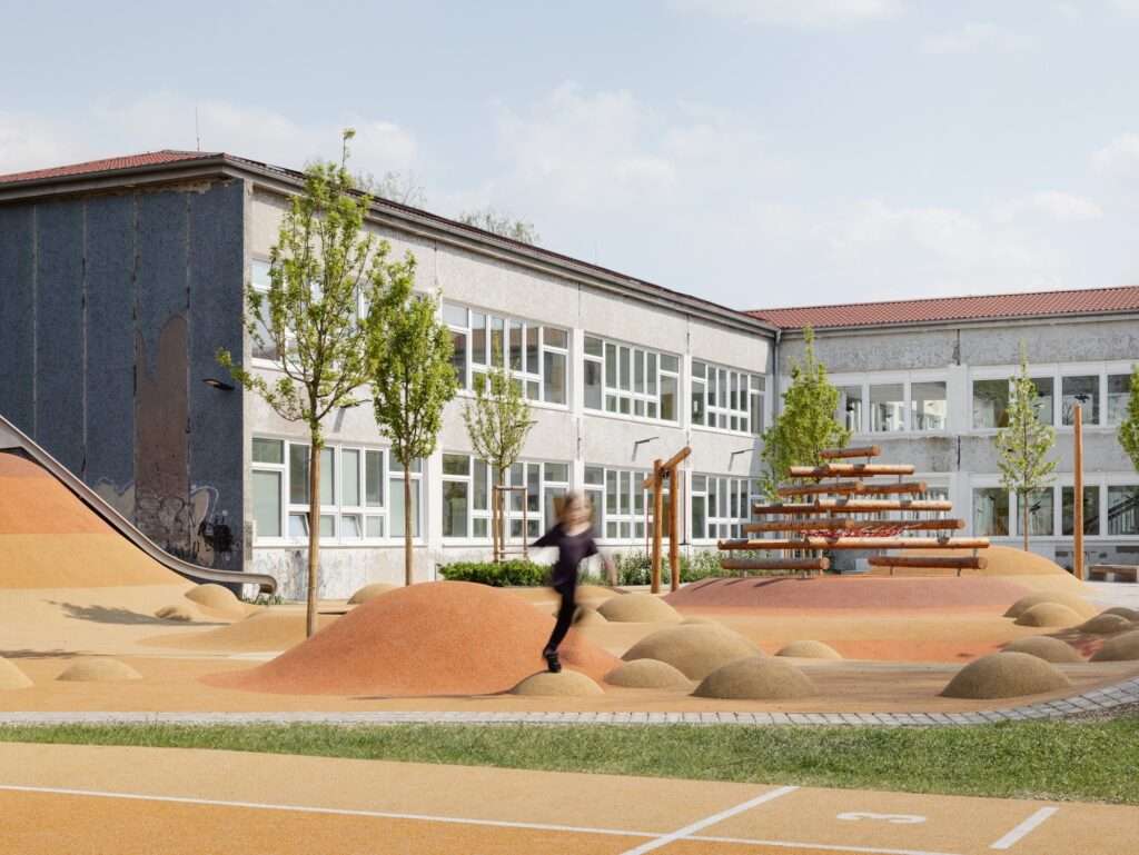 A child running through a schoolyard with textured, colorful ground surfacing and a playground in the background.