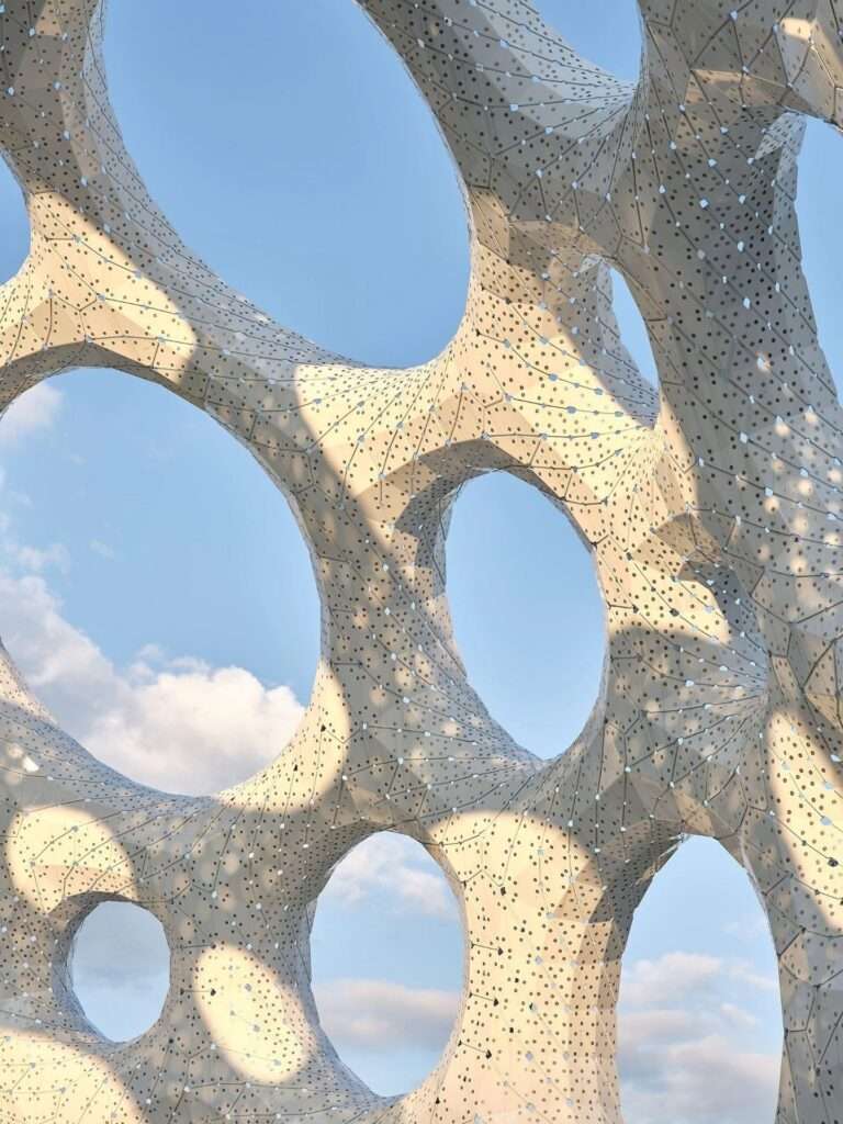 Close-up texture view of the white perforated structural metal skin of Moonrise pavilion against a bright blue sky, showcasing intricate shadow overlaps.