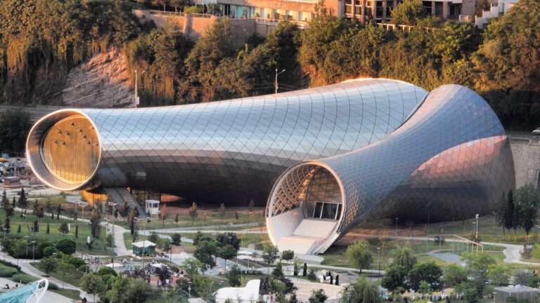 An exterior view of the conjoined tubular structures of Rike Concert Hall in Tbilisi.