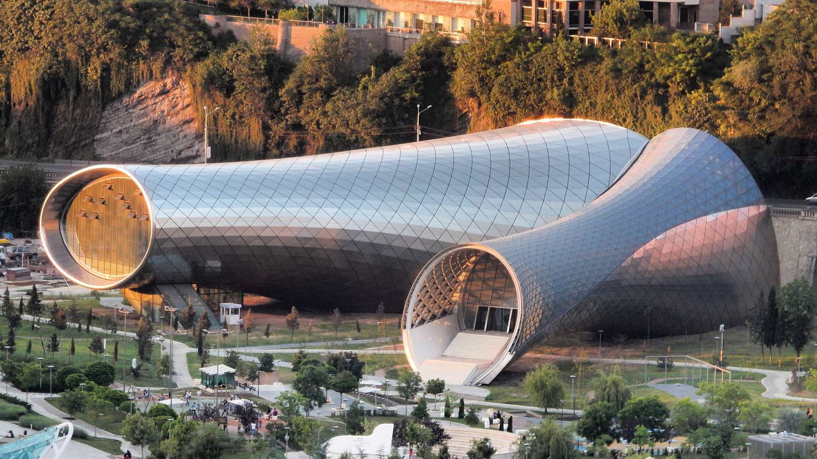 An exterior view of the conjoined tubular structures of Rike Concert Hall in Tbilisi.