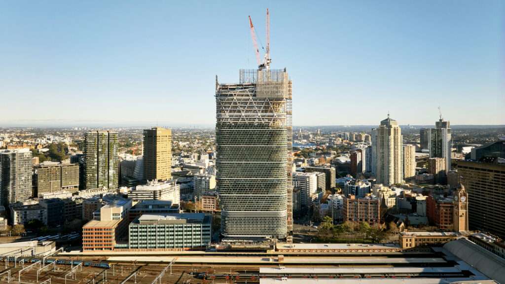 Wide aerial photograph showing the Atlassian Central hybrid timber tower under construction near Sydney Central Station.