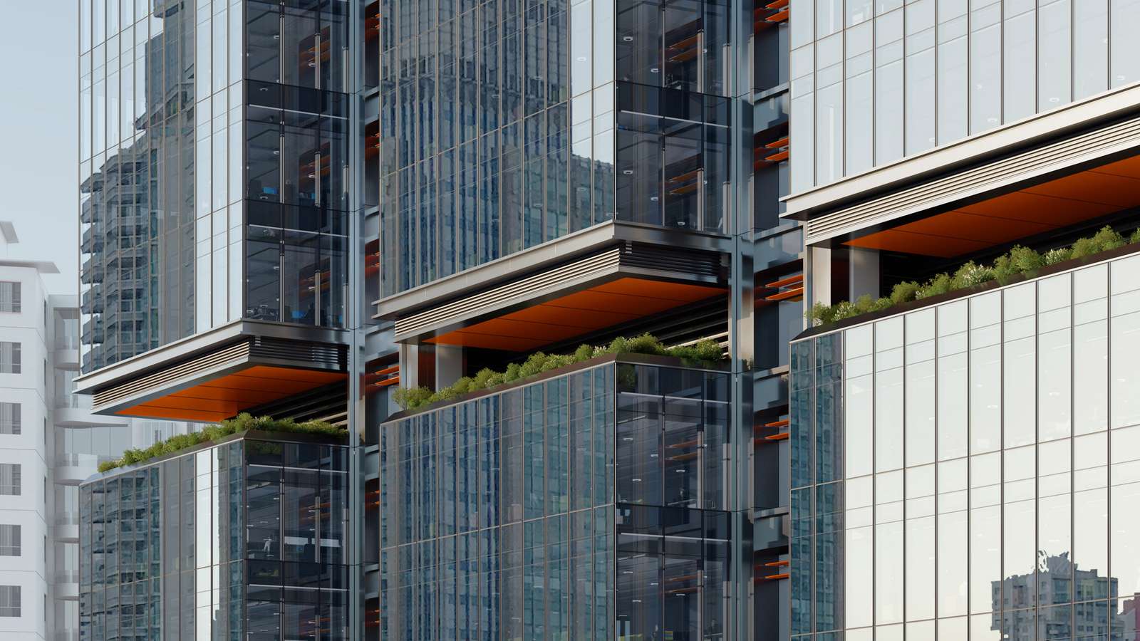 Close-up view of glass facade modules, orange-underside cantilevers, and sky garden planting beds.