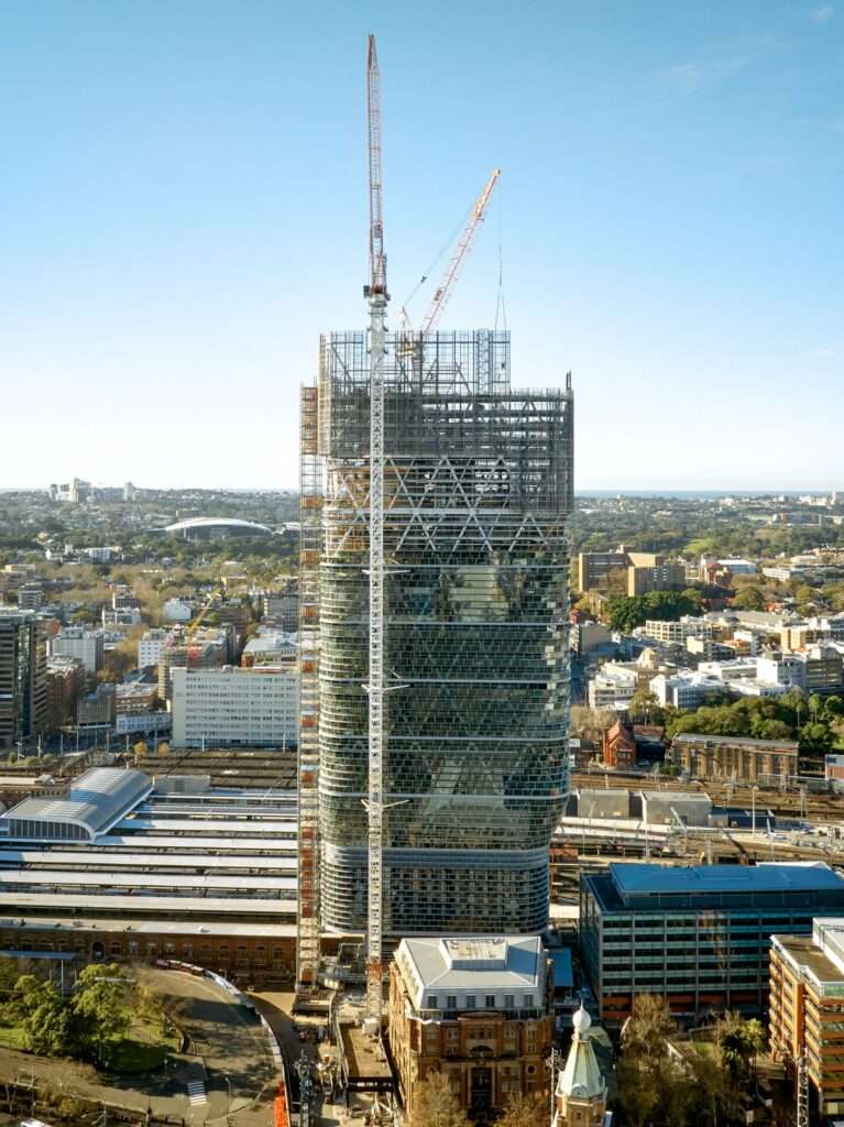 Elevated view showing the steel exoskeleton and facade installation of Atlassian Central skyscraper in Sydney.