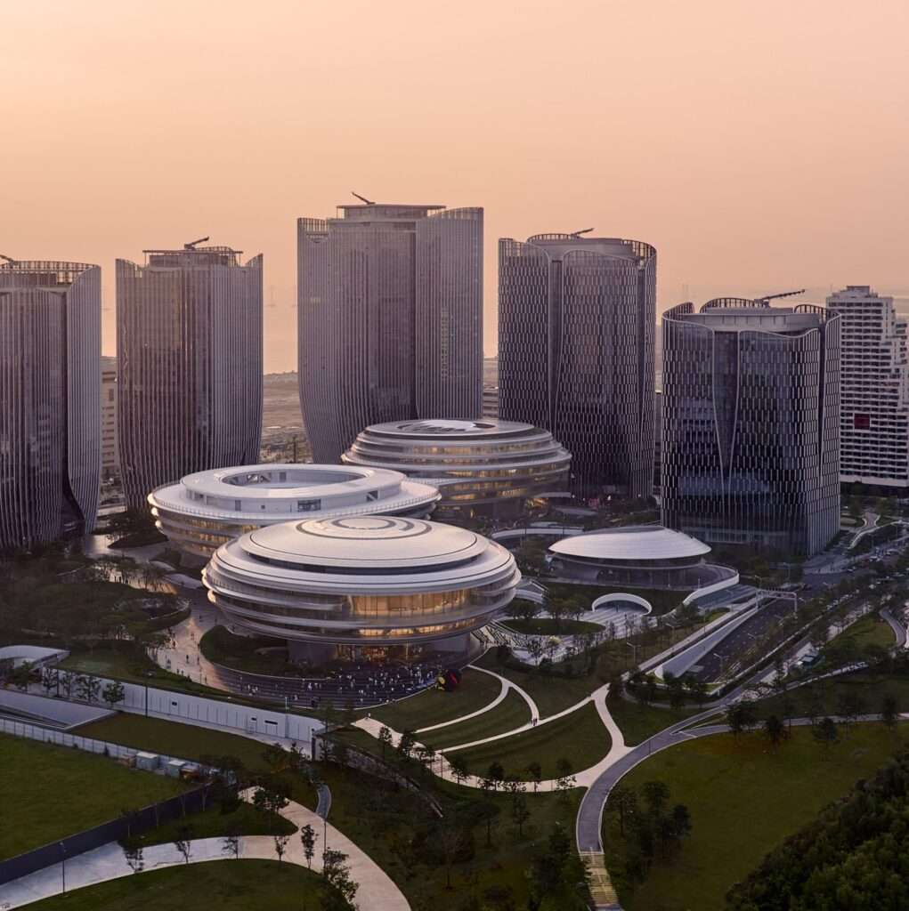 Elevated view of the round cloud buildings and office towers during sunset.