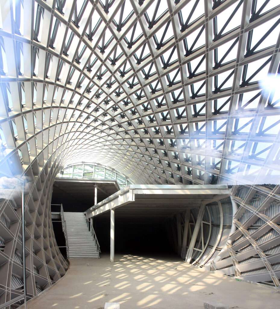 An interior view looking through the hollow steel framework showing structural framing and levels.