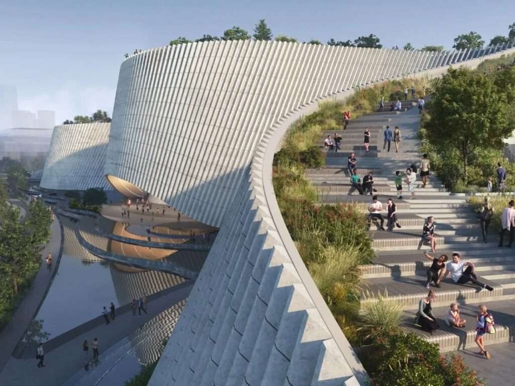 Visitors walking up the stepped green terrace and public ramps of the Shenzhen Natural History Museum.