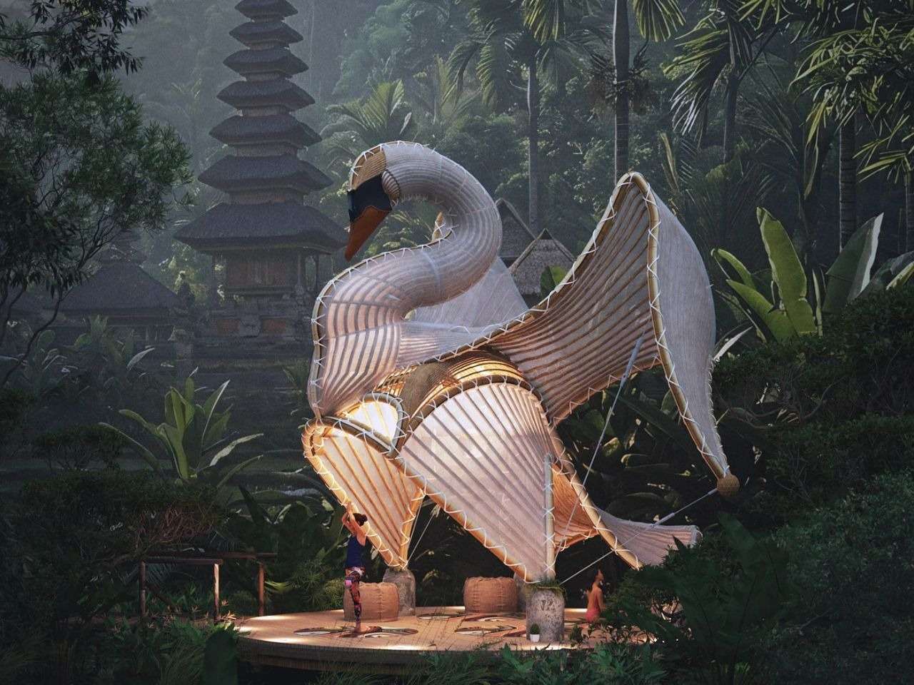 A person practicing yoga under the illuminated organic bamboo structure of the Swan Pavilion surrounded by lush tropical vegetation and traditional Balinese architecture.