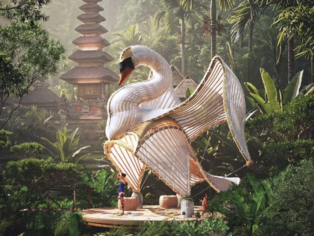 Wide shot of the Swan Pavilion in daytime light showing its sculptural swan-like wing form beside a traditional Balinese temple tower.