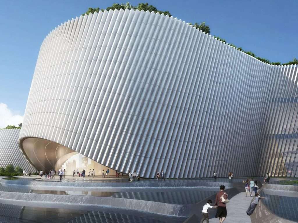 Close-up view of the vertical slatted facade and arched cavernous entry of Shenzhen Natural History Museum.