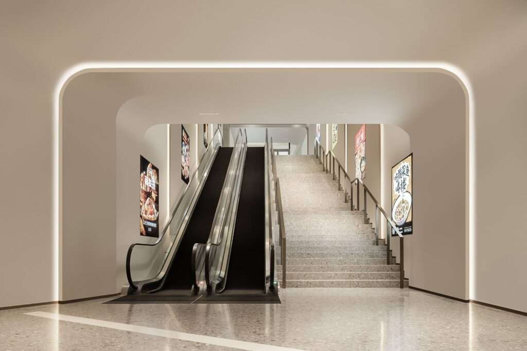 Minimalist white interior portal framing a public staircase and adjacent escalator with integrated linear LED lighting accents at Wuxi MixC Mall.