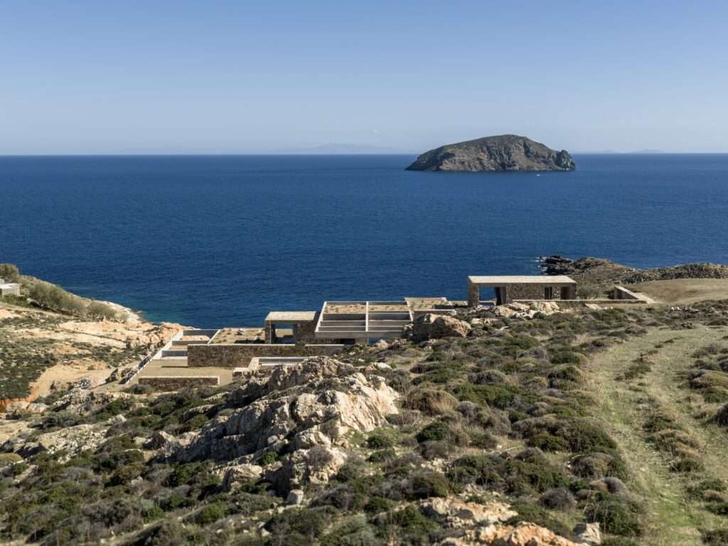 Panoramic view of the Perma residence on a remote Serifos cliffside overlooking the Aegean Sea.