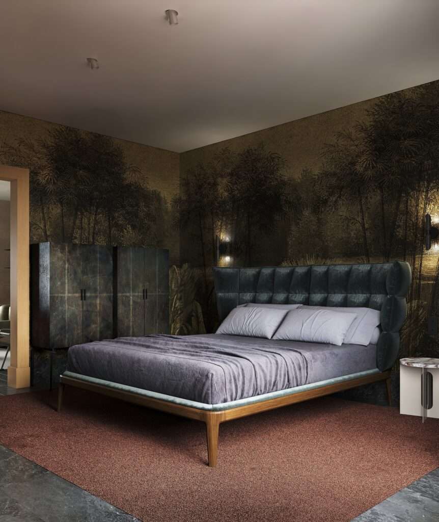 Modern upholstered bed with dark green tufted headboard set against a dark tropical landscape mural wallpaper.