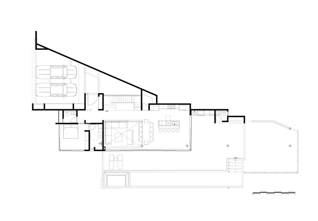 Architectural floor plan drawing showing the lower level layout, garage, living room, kitchen, and terrace of KUL Nosara.