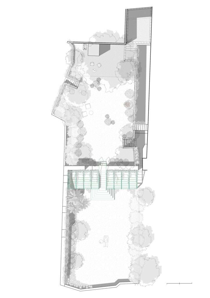 An architectural site plan drawing of the project, showing an elongated L-shaped garden layout. The greenhouse structure is rendered in green in the middle section against a long retaining wall, featuring a central staircase connecting the upper terraced garden area to the lower green lawn expanse.