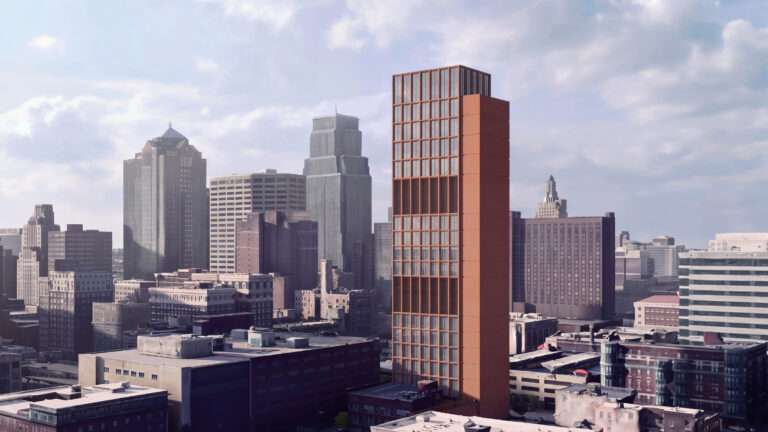 Aerial rendering showing a red masonry tower standing tall within the Kansas City skyline.