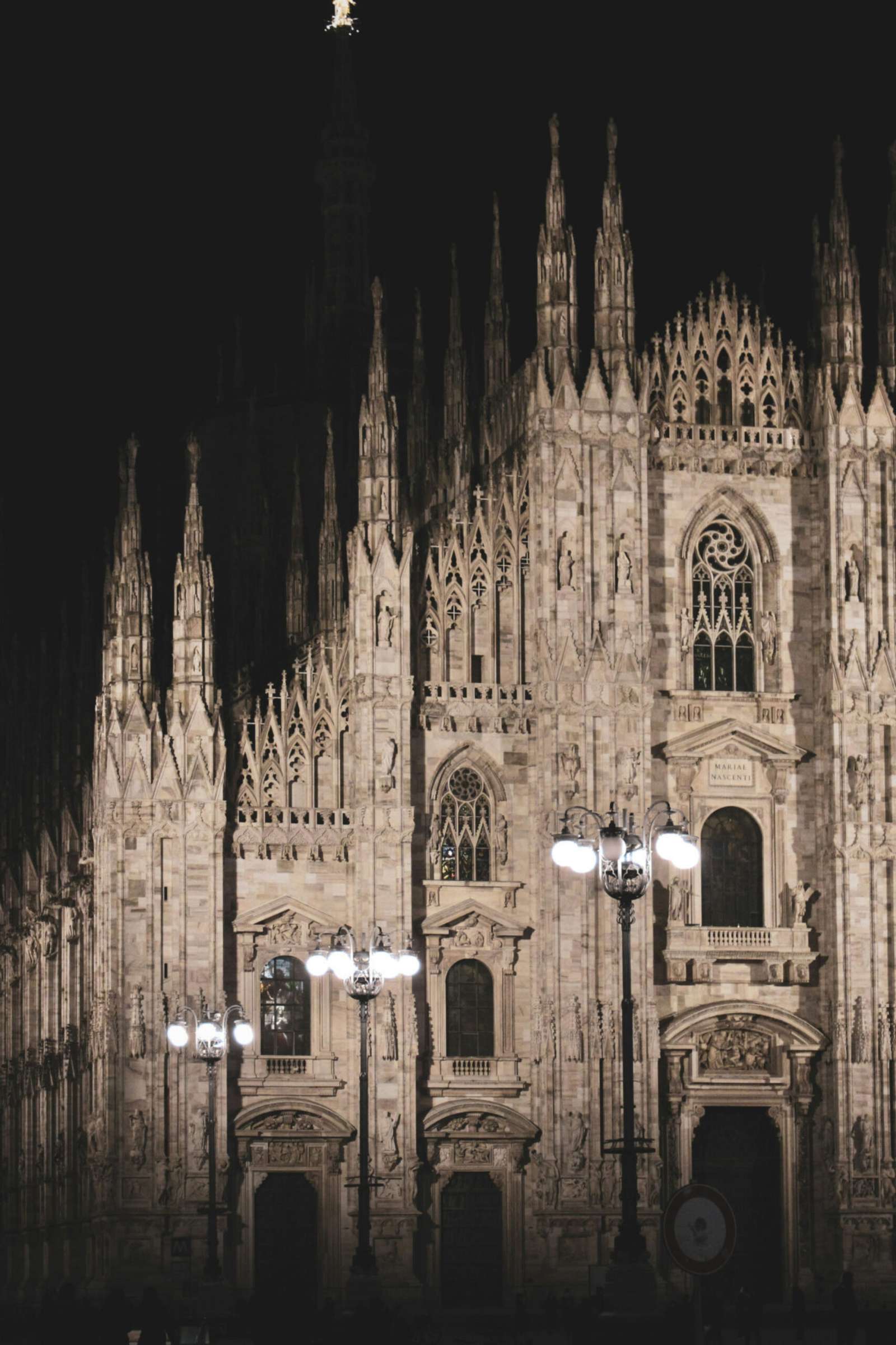 Milan Cathedral (Duomo di Milano) illuminated at night in Milan, Italy.