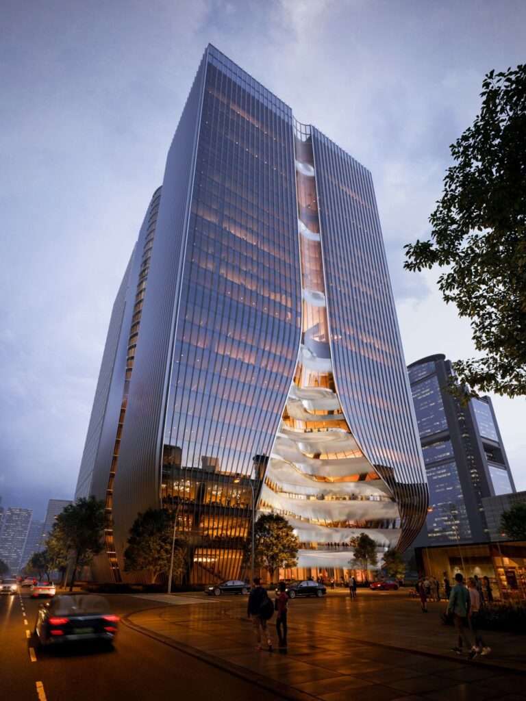 Tall skyscraper with glowing interior spaces illuminated at dusk alongside street traffic.