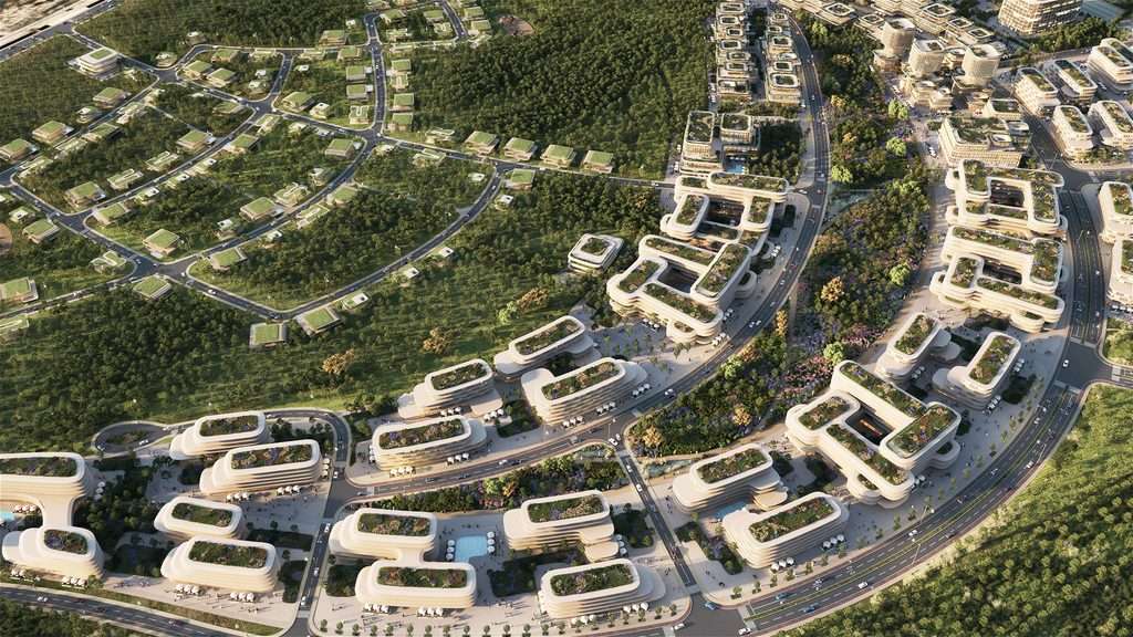 Close aerial angle showing rounded residential modules with green roof systems and courtyards