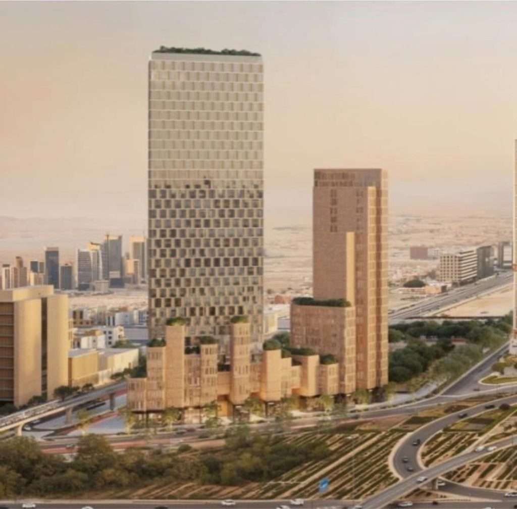منظر جوي عام لبرجي المشروع وسط شبكة الطرق والمحيط العمراني.