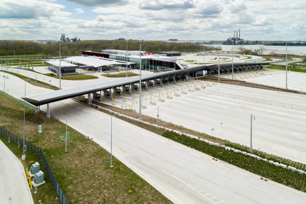 A dedicated multi-use lane running parallel to the roadway along the landscape edge with protective barriers.