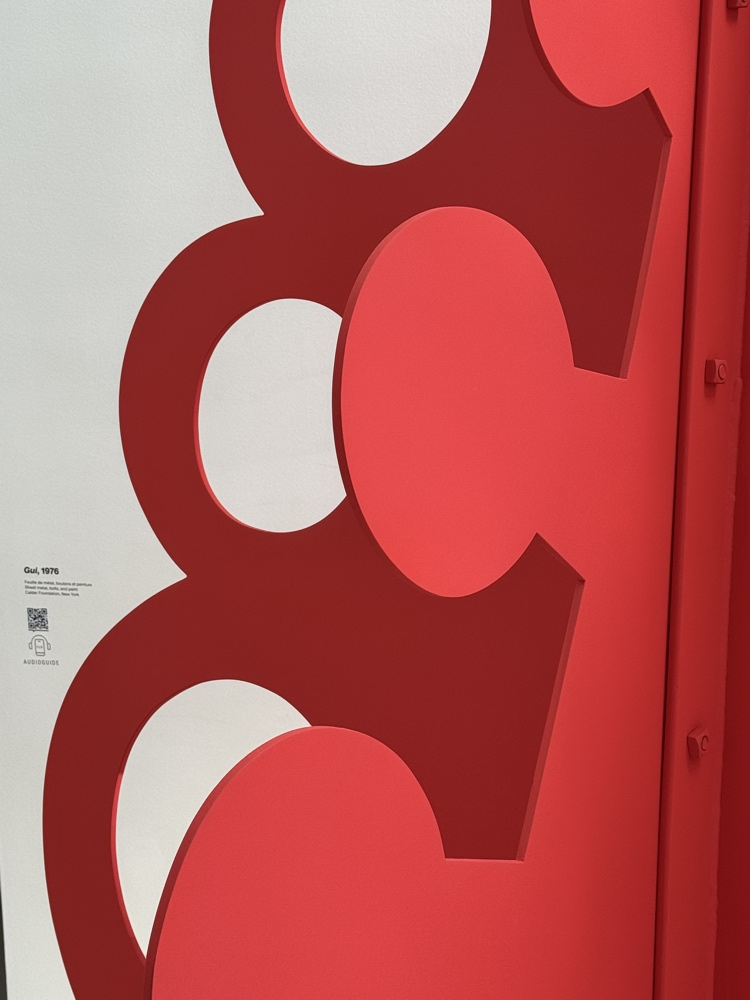 Detail of Alexander Calder's red sheet-metal sculpture Gui, 1976.
