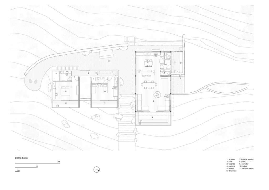 Architectural floor plan of Japú House by AIA Estúdio showing suite blocks, central courtyard, and social pavilion aligned along contour lines.