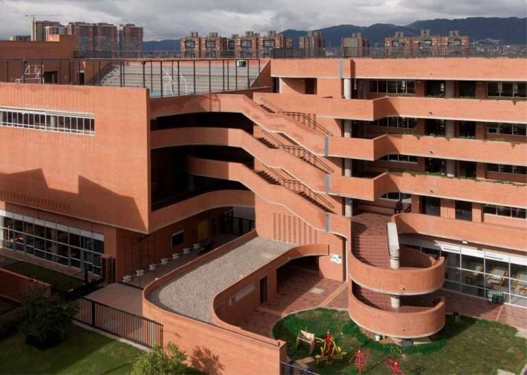 Aerial view of the brick courtyard and multi-level outdoor staircase at Feliza Bursztyn School in Bogotá.