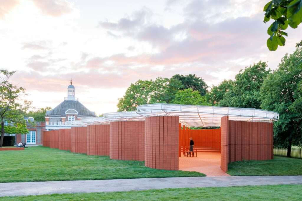 Serpentine Pavilion red brick curved wall sunset evening architecture London