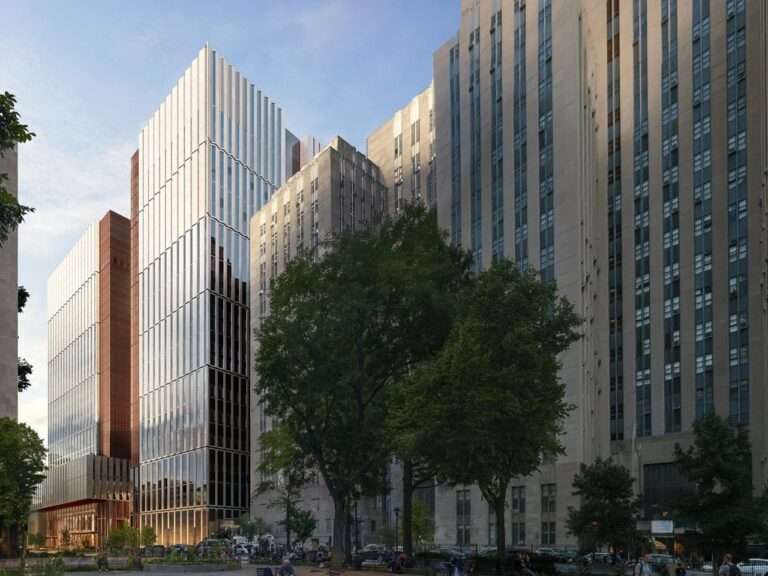 Modern high-rise Manhattan Detention Center building integrated into the urban streetscape along White Street.