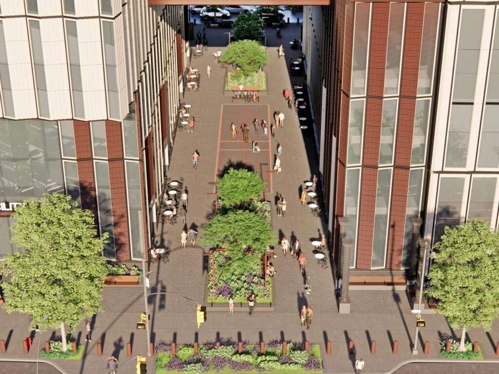 Top-down view of a public pedestrian arcade cutting through the ground level of the Manhattan Detention Center.