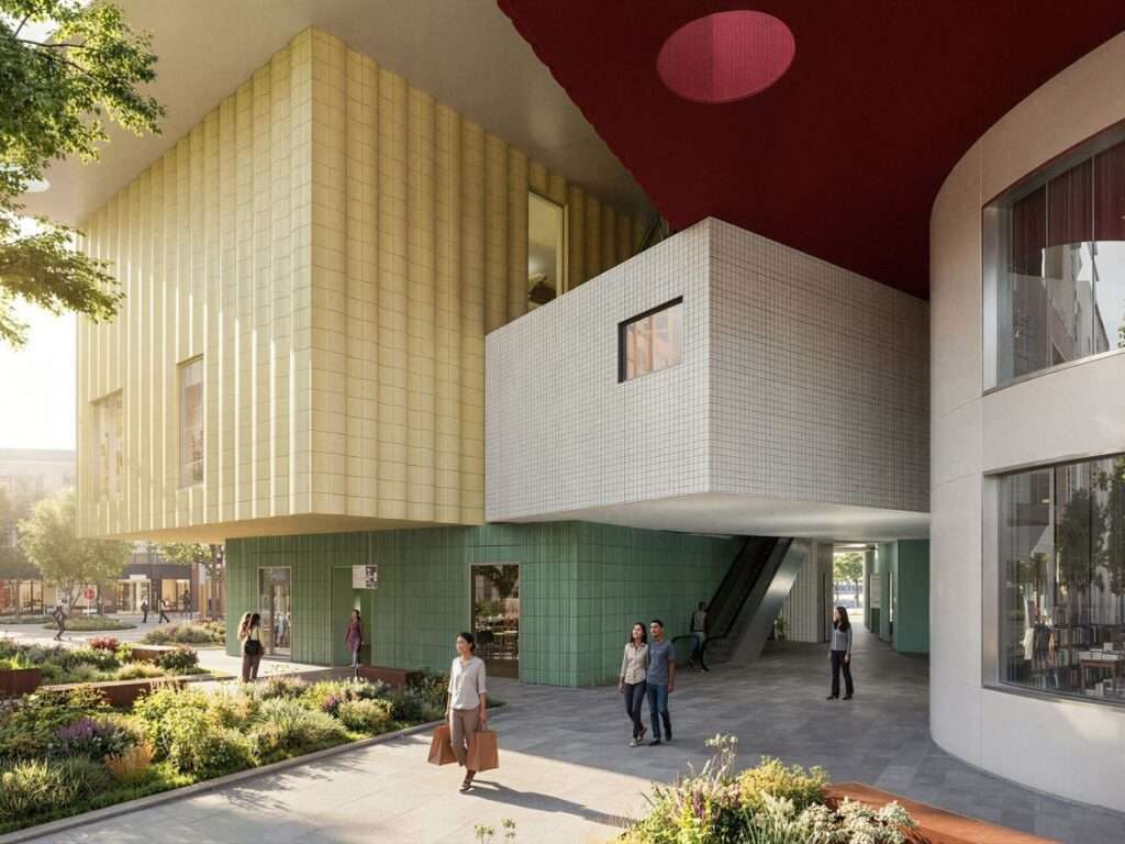 Ground-level public plaza surrounded by cantilevering textured blocks and landscaped walkways at Bihailou Art Village.
