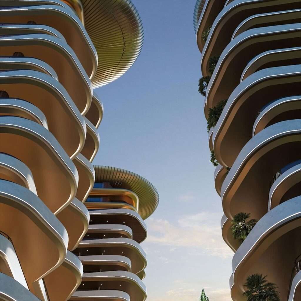 Low-angle view looking up at the tiered curved cantilever balcony edges and underside of the golden aluminum crown at Montemar Residential.
